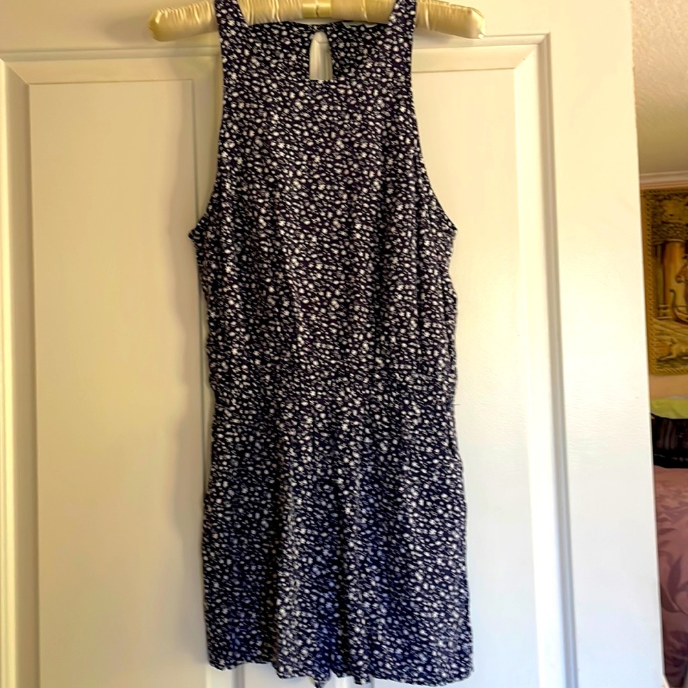 Blue floral jumper with pockets and button back, sleeveless size 38 girls